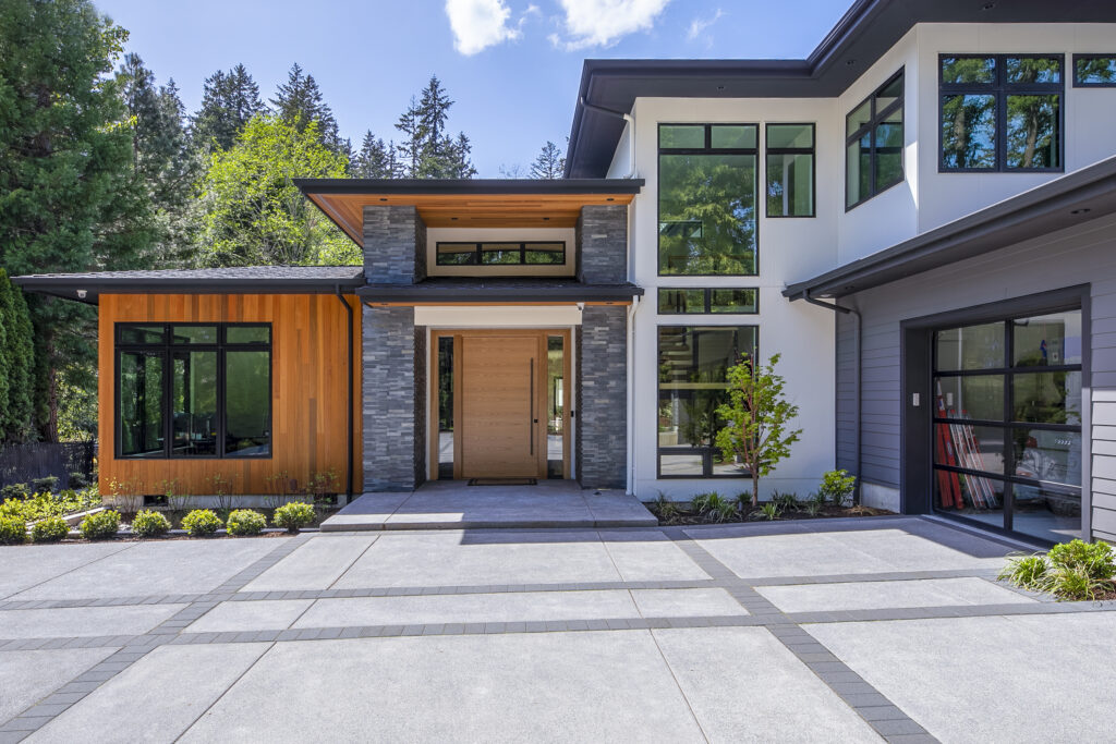 Professional exterior photography of a modern two-story residential home with manicured landscaping in Portland, OR