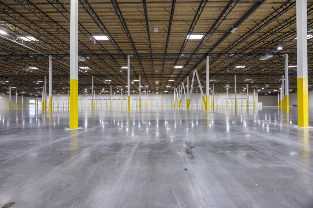 Professional industrial warehouse interior photography featuring expansive floor space and high ceilings in Portland